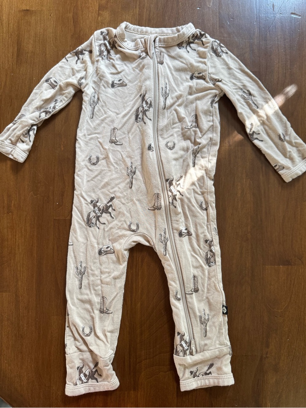 Kyte BABY Cream Cowboy Print Zippered One-Piece Footie